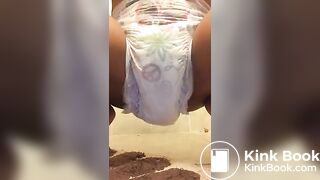 Ebony chick messes diaper