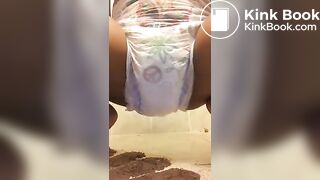 Ebony chick messes diaper