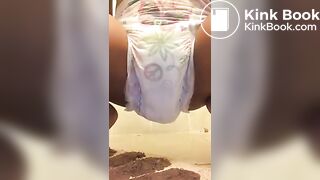 Ebony chick messes diaper