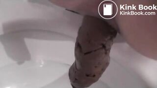 Milf shitting over toilet