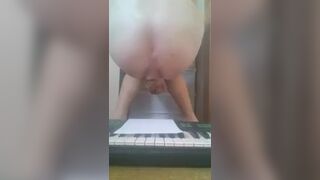 Girl shits on piano