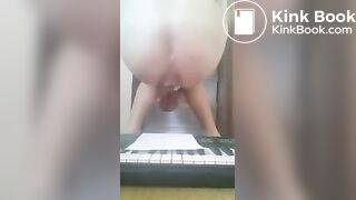Girl shits on piano