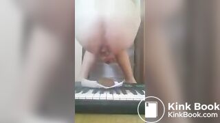 Girl shits on piano