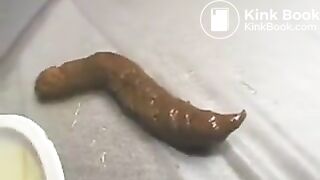 Naked Jap babe manage to poop a long turd in library