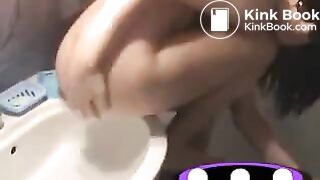 Poooooping girl in sink