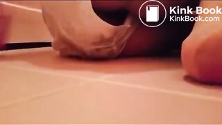 Woman shits in her panty on the bathroom floor.