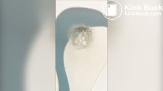 Woman shitting public toilet at restaurant.