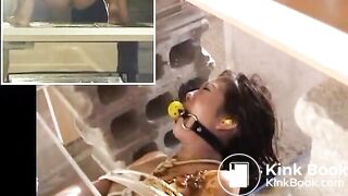 Clothed women pissing and shitting on a naked bounded girl with a gag in her mouth