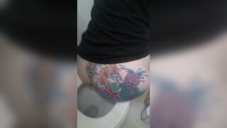 Tatoed woman take a big dump