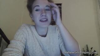 Cute teen girl sits on the toilet in front of the camera. She starts poopin