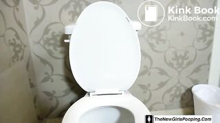 Girl shitting on the toilet