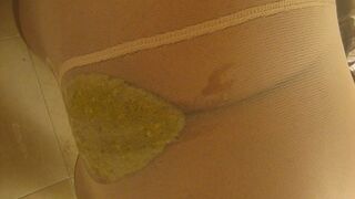 Latina shitting and peeing in white pantyhose