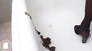 Sexy brunette shitting