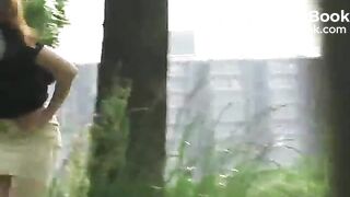 Young woman shitting outdoor