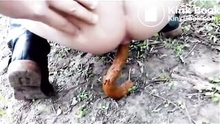 Guy filming his girl shitting in nature