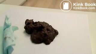 Fit webcam model shitting on a table and filming it