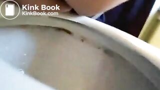Cute amateur poop over toilet