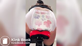 Girl poops diaper on bike