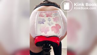 Girl poops diaper on bike