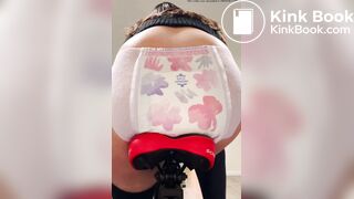 Girl poops diaper on bike
