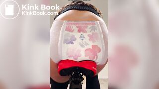 Girl poops diaper on bike