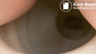 Girl shitting into toilet