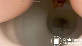 Girl shitting into toilet