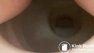 Girl shitting into toilet