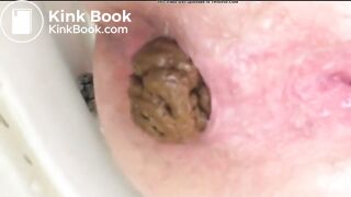 girl dropping her poop in the toilet