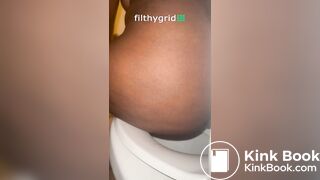 Sexy ebony on toilet