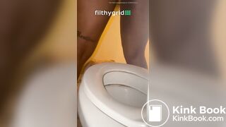Sexy ebony on toilet