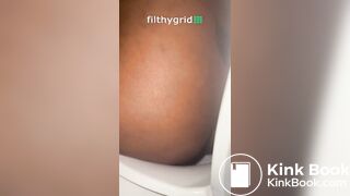 Sexy ebony on toilet