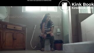Girl take a shit on the toilet