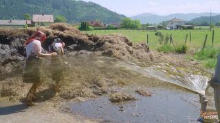 Two girls sprayed with cowshit by a slurry tanker