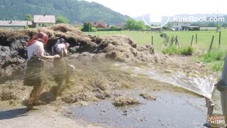 Two girls sprayed with cowshit by a slurry tanker