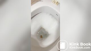 Beautiful girl shows big turd as it falls into toilet