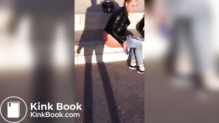 Beautiful female rider poops outdoors.