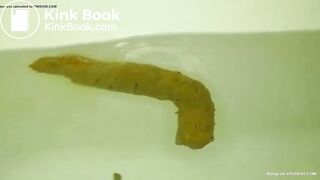 constipated asian girl pushes out huge shit in the tub