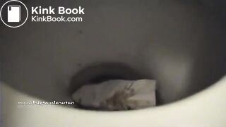 Squatting teen pooping on a toilet..
