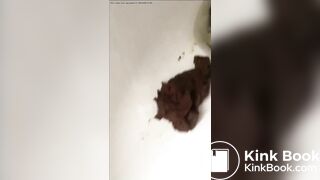 Cute brunette shits in the toilet