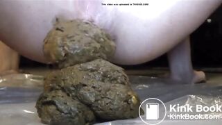 girl squirts out a tasty looking pile of shit (closeup)