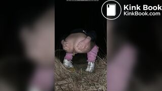 Girl pooping at night in the field