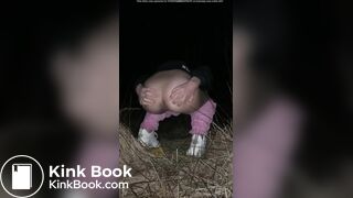 Girl pooping at night in the field