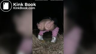Girl pooping at night in the field