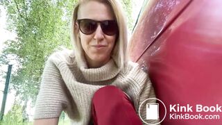 Woman pooping by the car